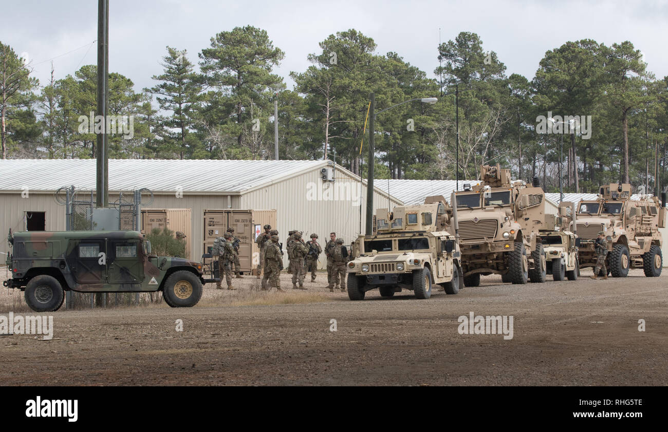 U.S. Army advisors from 2nd Security Force Assistance Brigade based out of Fort Bragg, N.C., gather for a vehicle movement and evacuation procedures brief at Fort Polk, La, Jan. 17, 2019. The 2nd SFAB is conducting pre-deployment training at the Joint Readiness Training Center as they prepare to deploy to Afghanistan in the spring of 2019 to provide training and advising assistance to Afghan National Security Forces. (U.S. Army photo by Spc. Andrew McNeil / 22nd Mobile Public Affairs Detachment) Stock Photo