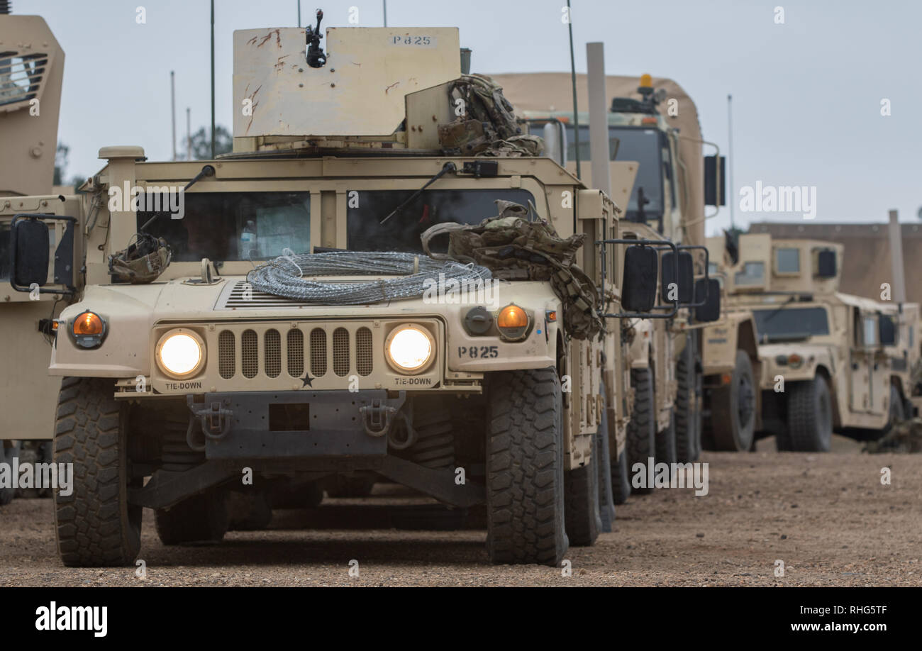 U.S. Army advisors from the 2nd Security Force Assistance Brigade based out of Fort Bragg, N.C., and the Wisconsin National Guard prep and stage their vehicles while training at the Joint Readiness Training Center at Fort Polk, Louisiana, Jan. 18, 2019. The 2nd SFAB is conducting pre-deployment training at the JRTC as they prepare to deploy to Afghanistan in the spring of 2019 to provide training and advising assistance to Afghan National Security Forces. (U.S. Army photo by Spc. Andrew McNeil / 22nd Mobile Public Affairs Detachment) Stock Photo