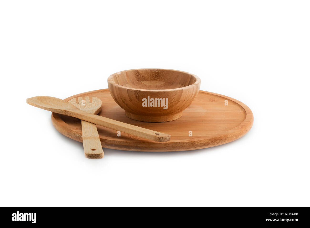 Wooden plate, bowl, spoon and fork isolated on white background bamboo top view Stock Photo