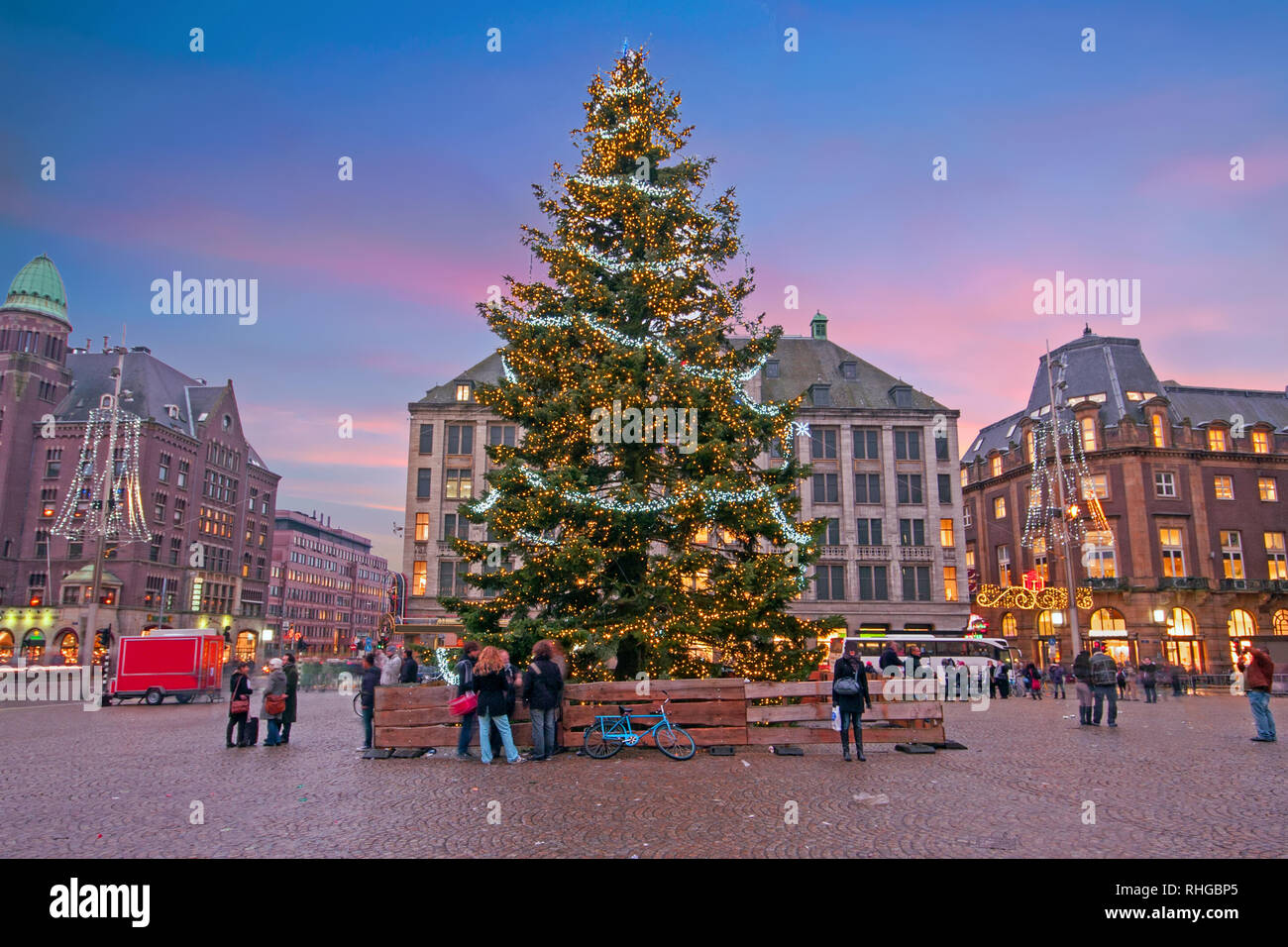 Amsterdam at christmas time on the Dam square in the Netherlands at sunset Stock Photo