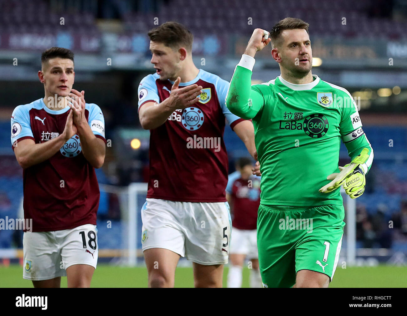 Burnley's Ashley Westwood (left) and James Tarkowski (centre) as Tom Heaton  (right) celebrates the point after the Premier League match at Turf Moor,  Burnley Stock Photo - Alamy