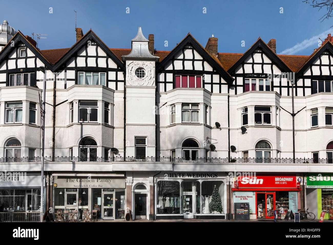 Urban view of Worthing, West Sussex, UK featuring a parade of shops Stock Photo
