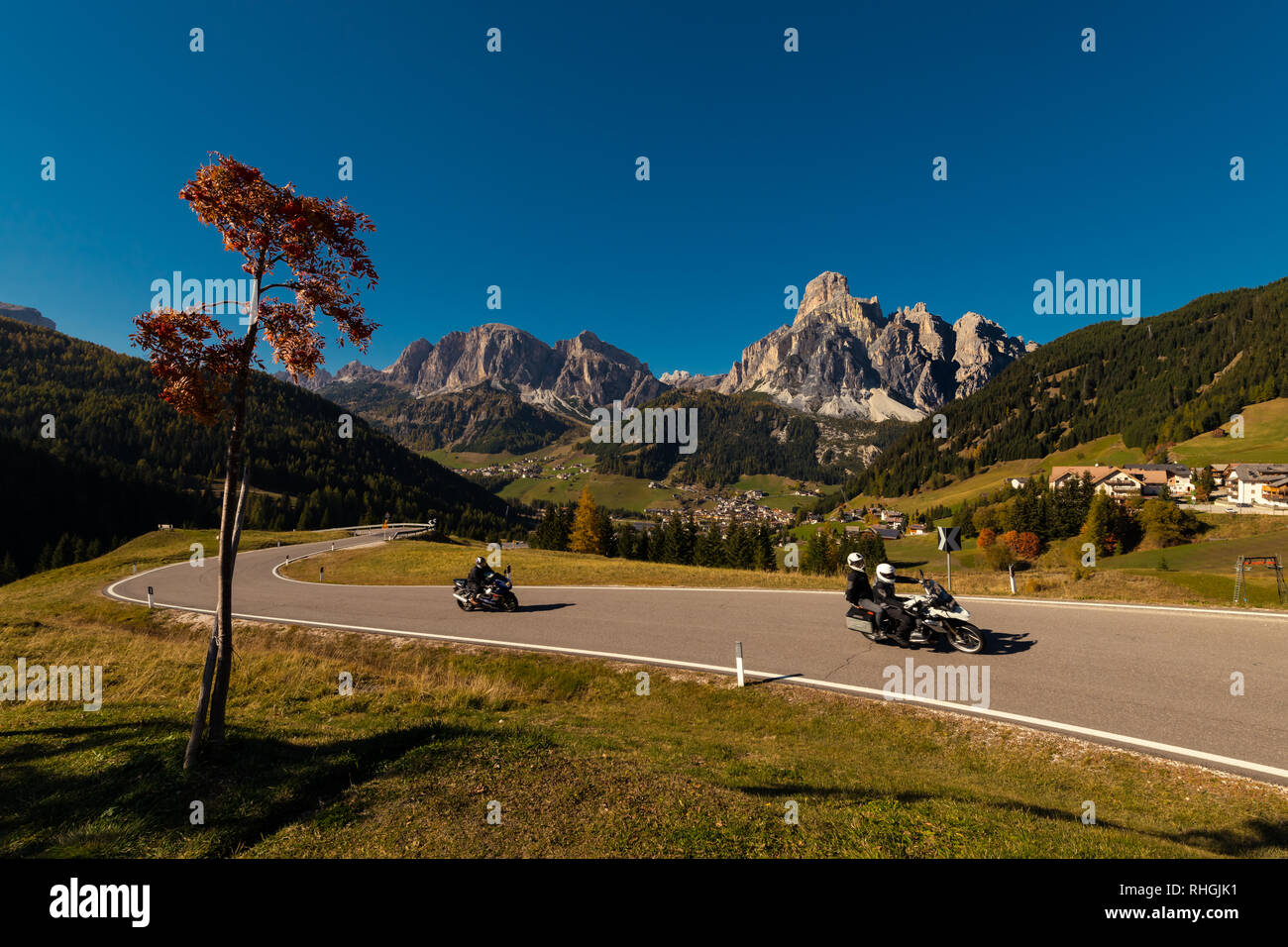 Oct. 2018, Alta Batia, Hochabteital, Dolomiten, Suedtirol, Italien, Motorcycle in the autumn on a pass road with blue sky Stock Photo
