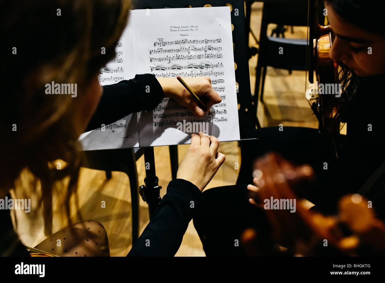 Valencia, Spain January 25, 2019 Two women musicians correcting a