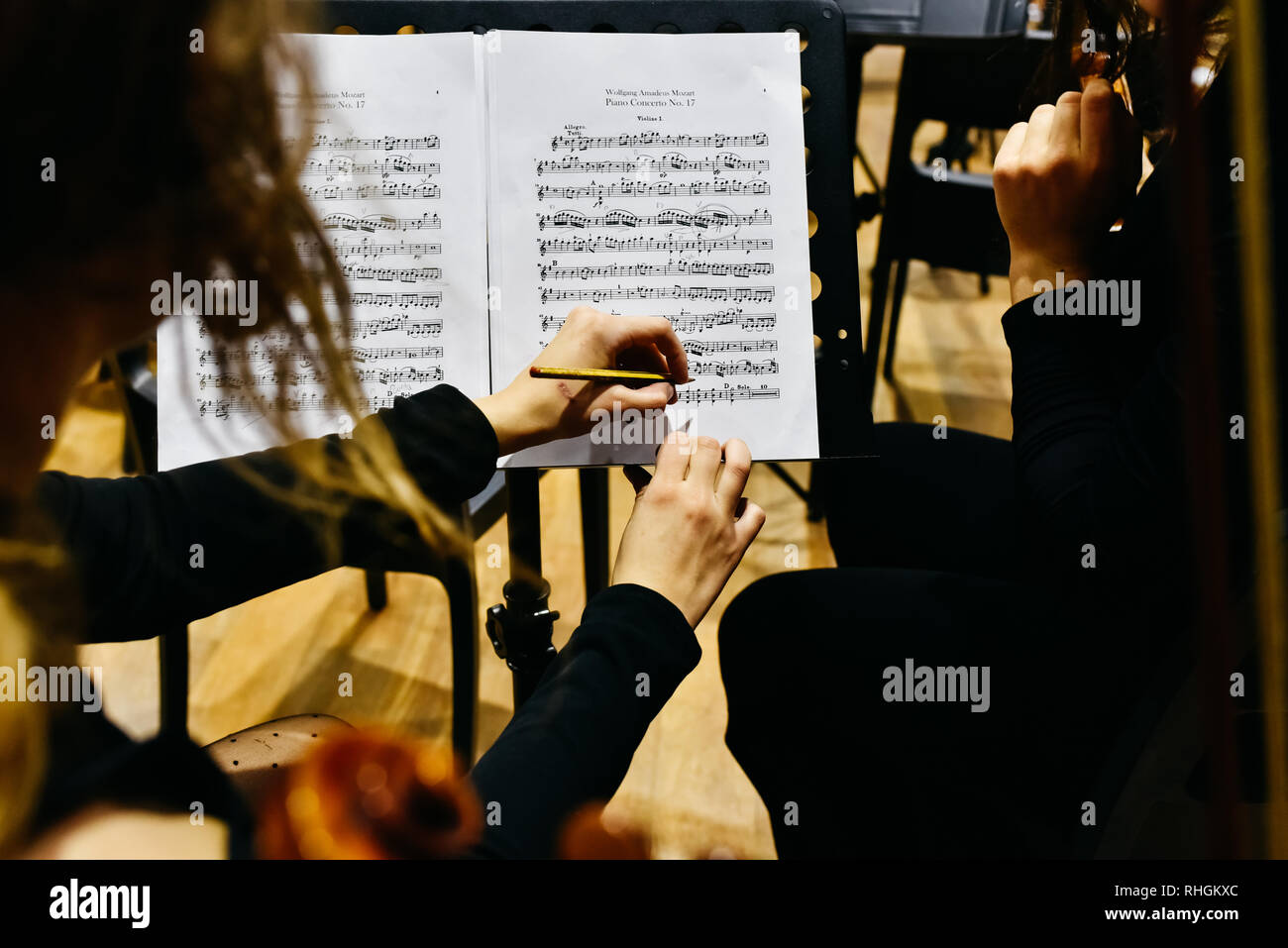 Valencia, Spain January 25, 2019 Two women musicians correcting a