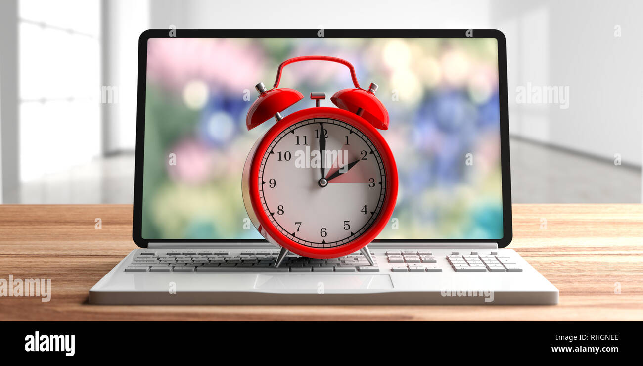 European daylight saving time end. Red alarm clock on a computer laptop