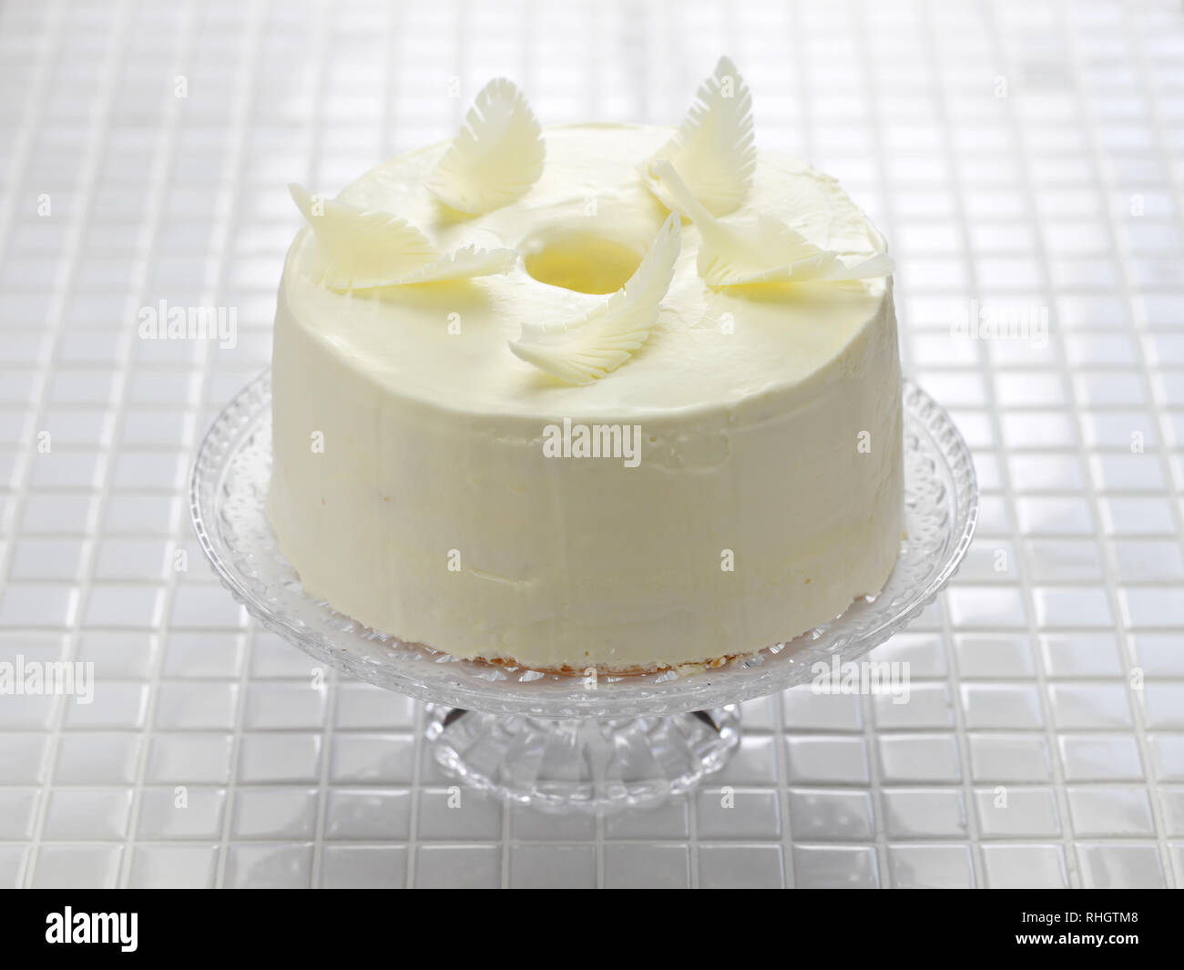 homemade angel food cake garnish ideas, white chocolate feathers Stock Photo Alamy