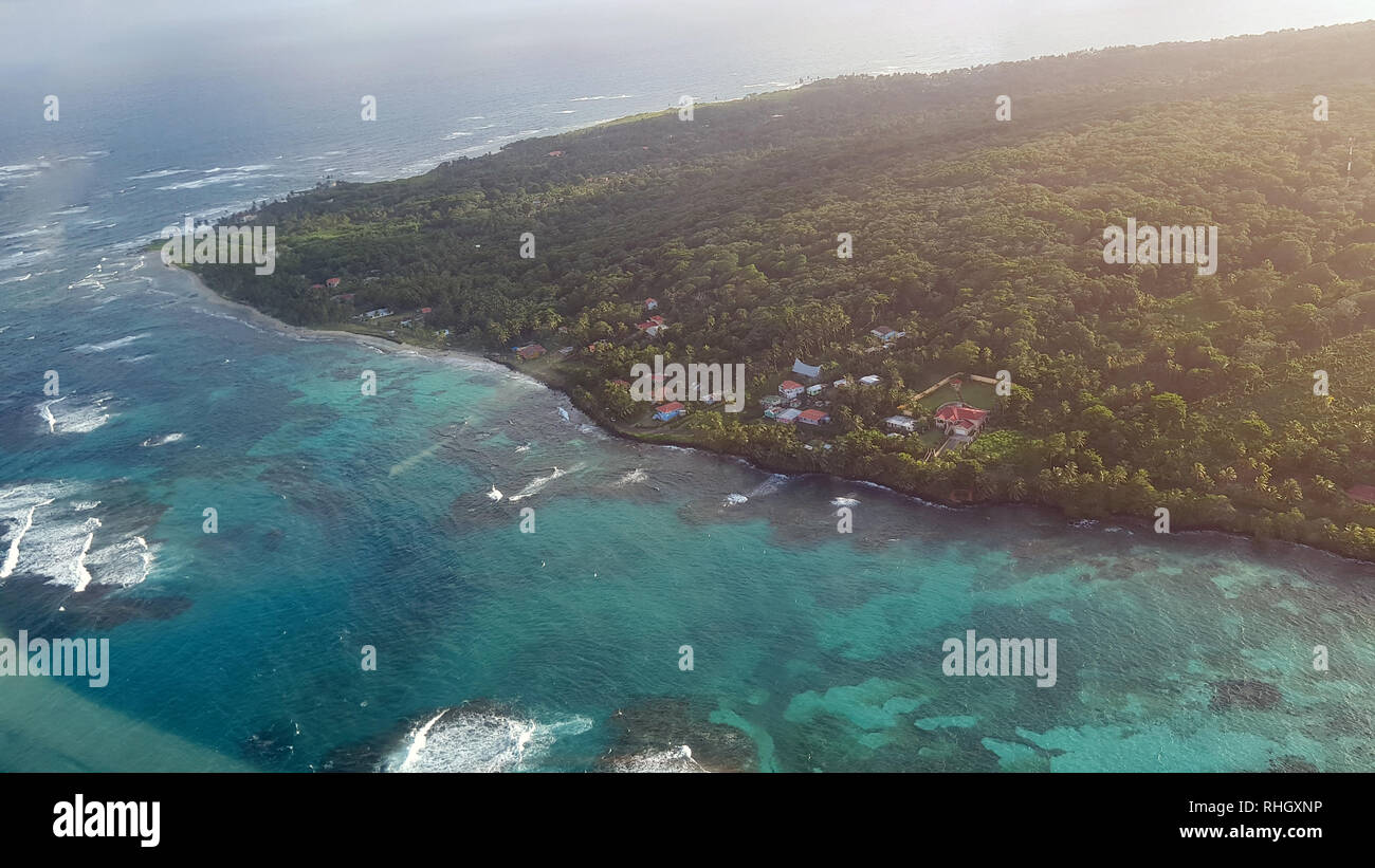 Caribbean island above drone view on bright sunny day Stock Photo