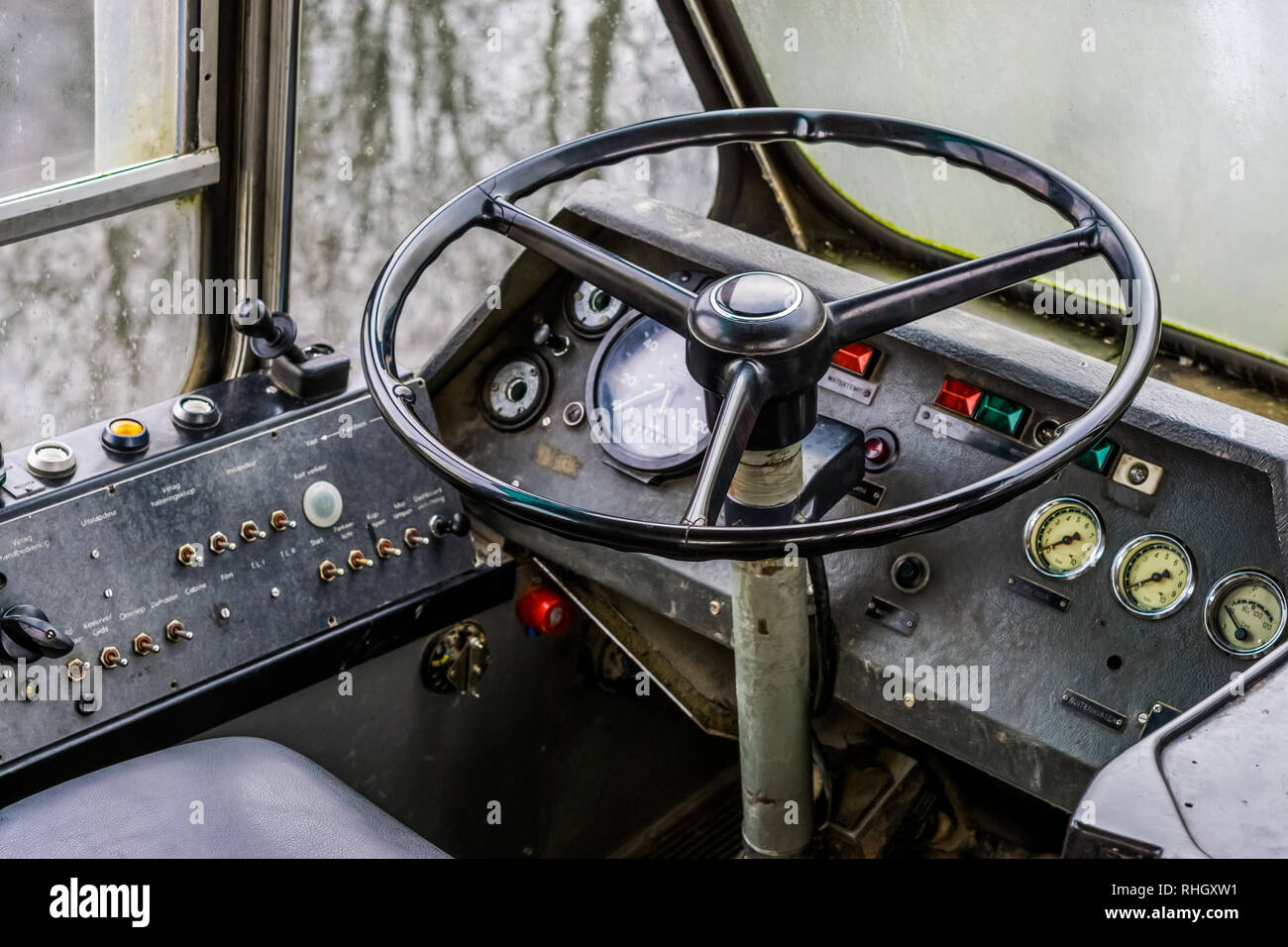 very old vintage interior of a old timer school bus, dashboard with