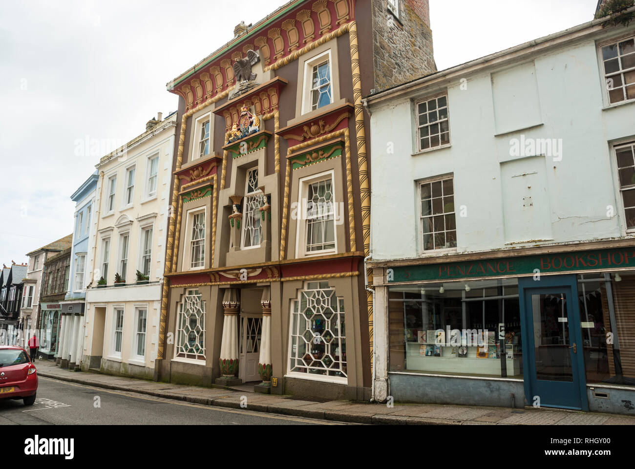View along Chapel Street, Penzance, Cornwall with the amazing colourful facade and architecture of Egyptian House. Stock Photo