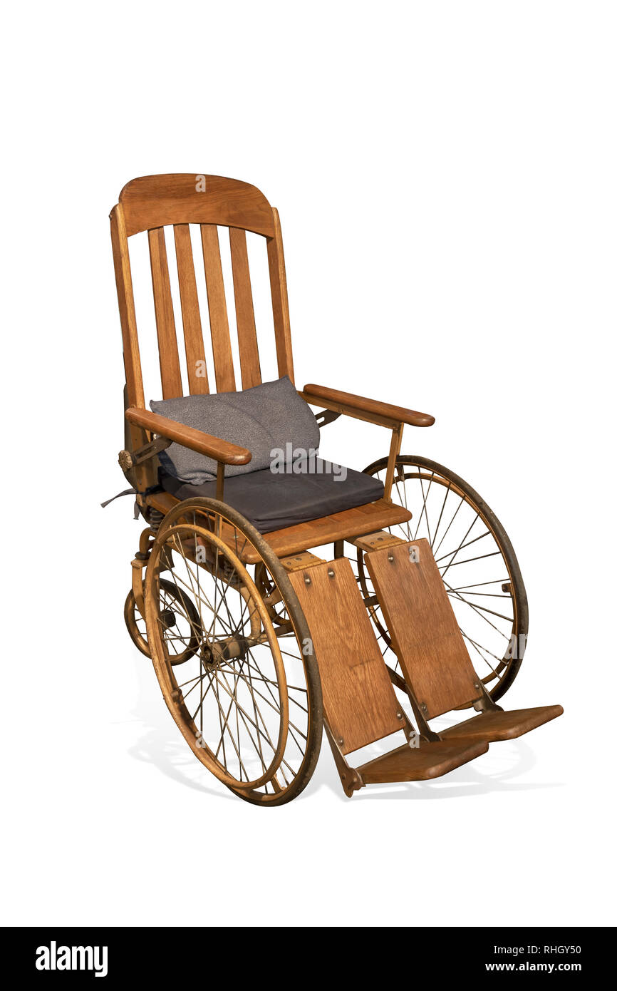 Antique wooden wheelchair isolated on white background with clipping