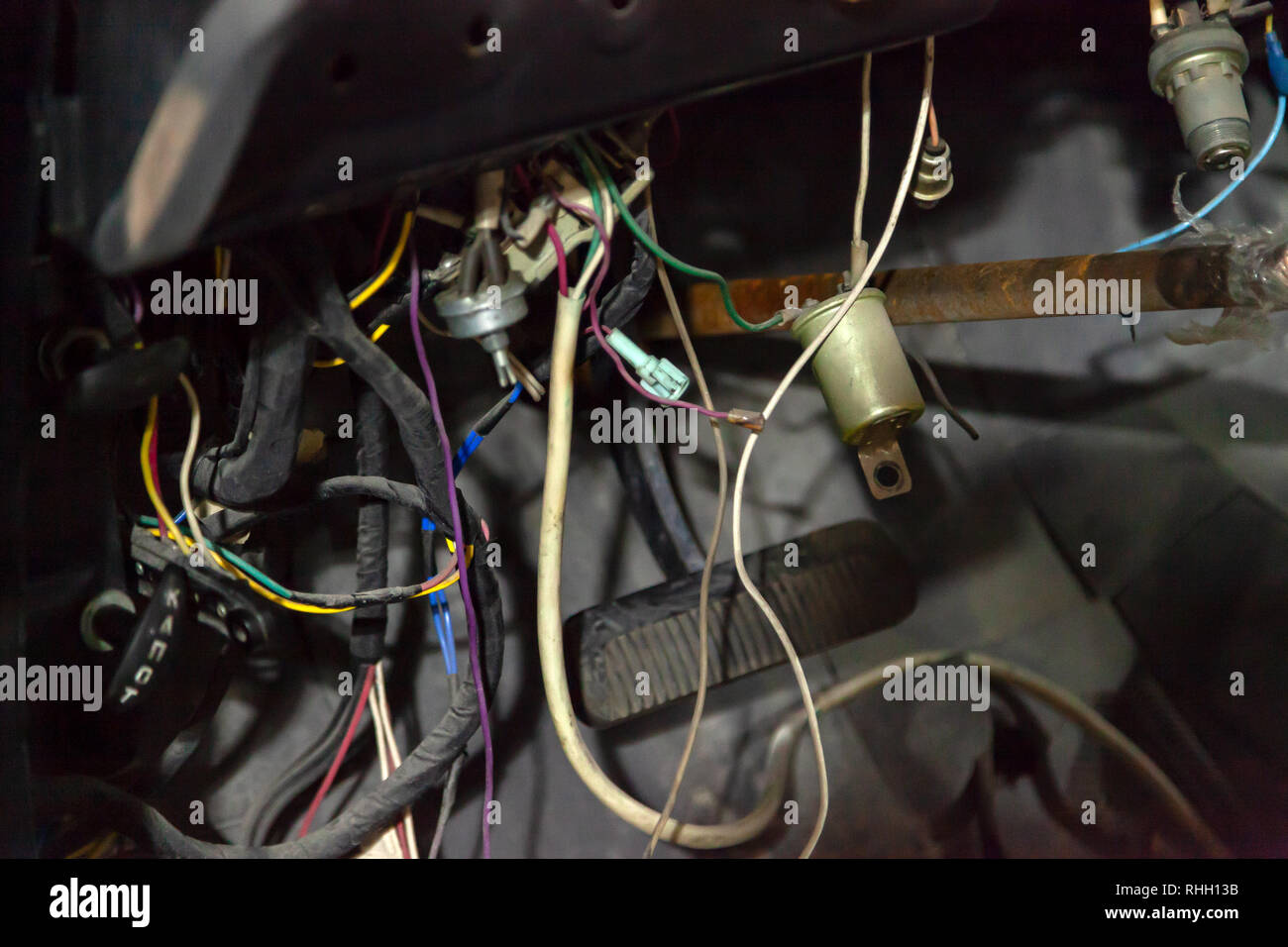 Novosibirsk, Russia - 01.30.2019: Automotive wiring of an old Russian car car gas 13 gul chaika under the dashboard for repairing and connecting elect Stock Photo