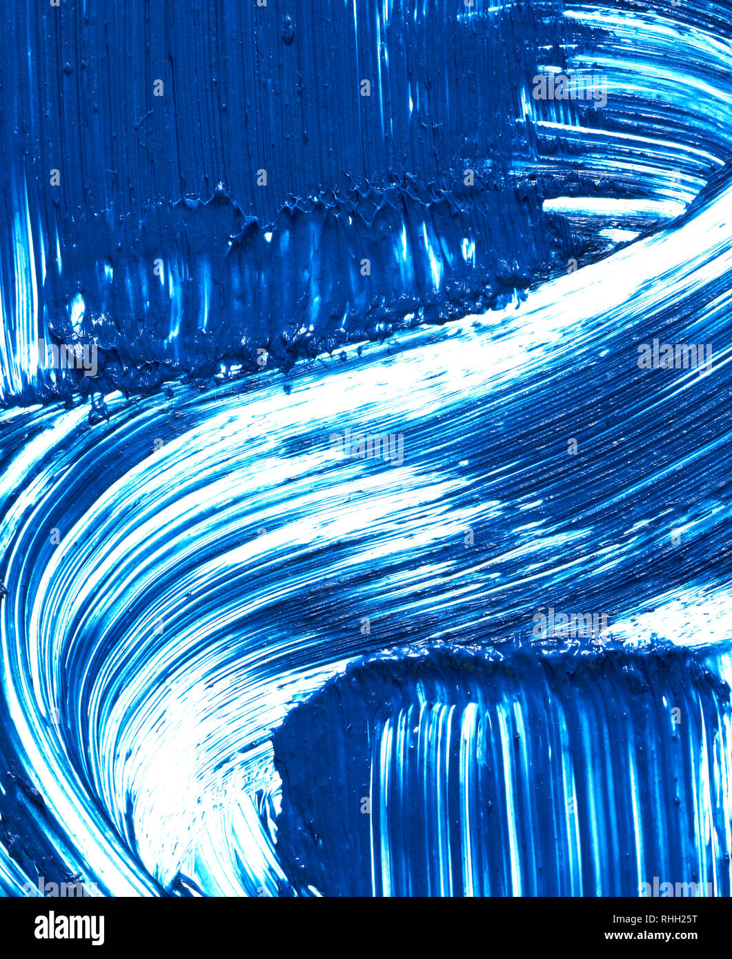 Texture of blue mascara for eyelashes isolated on white background. Smear of navy blue mascara for eyelashes on white background. Stock Photo