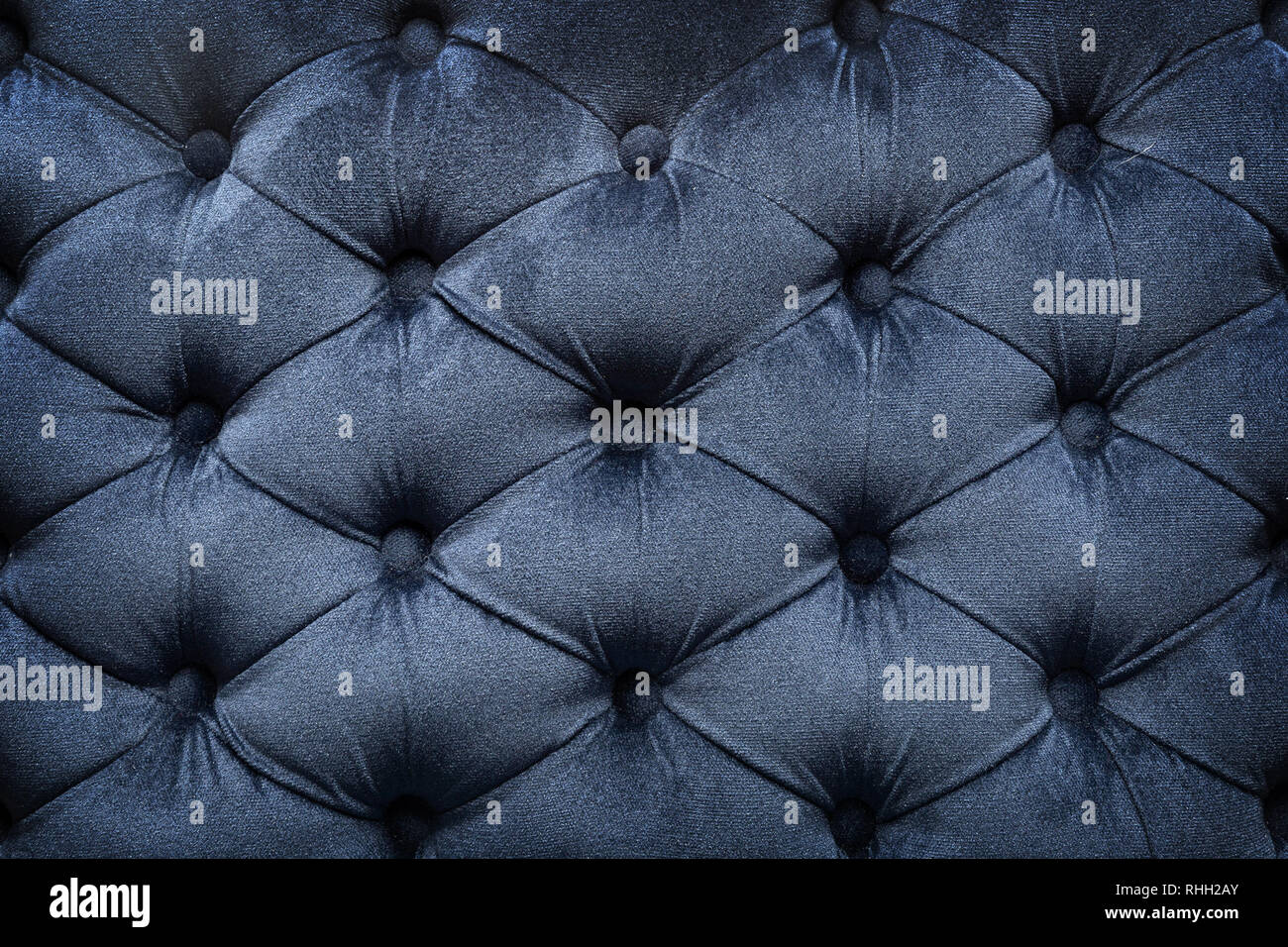 Quilted velvet dark fabric as a background Stock Photo