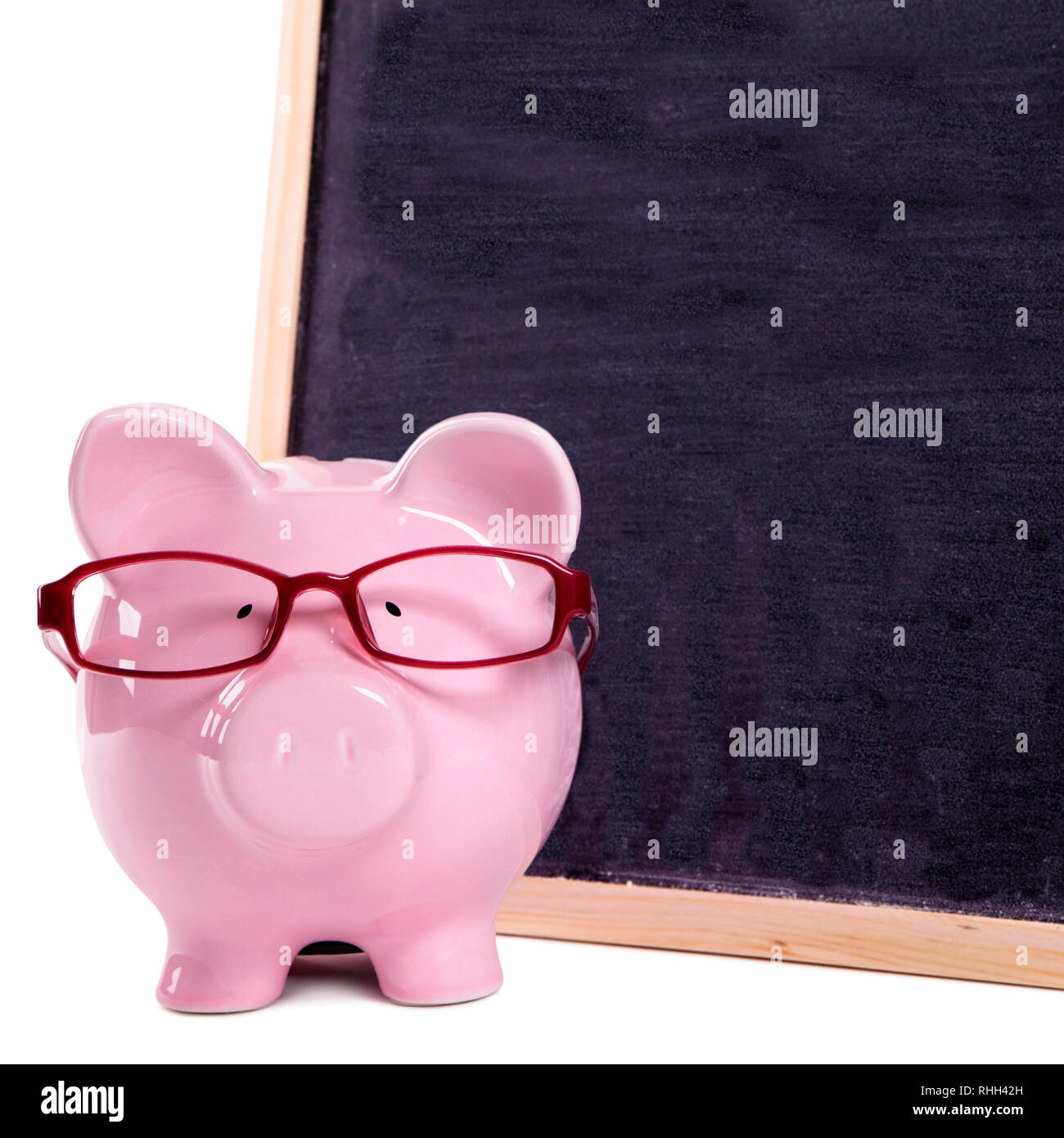 Piggy bank wearing glasses Stock Photo - Alamy