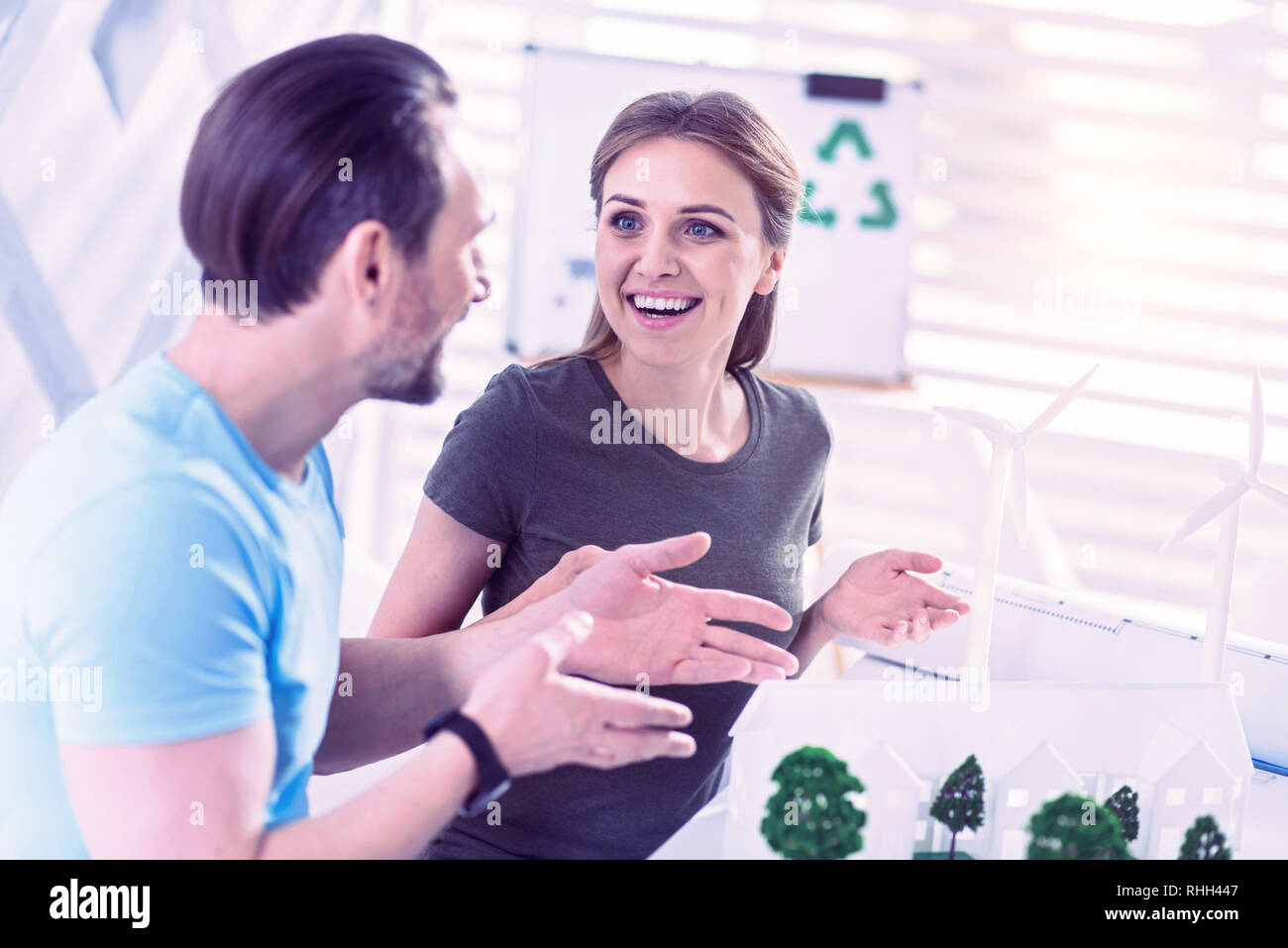 Young engineer feeling excited while talking about her eco project Stock Photo