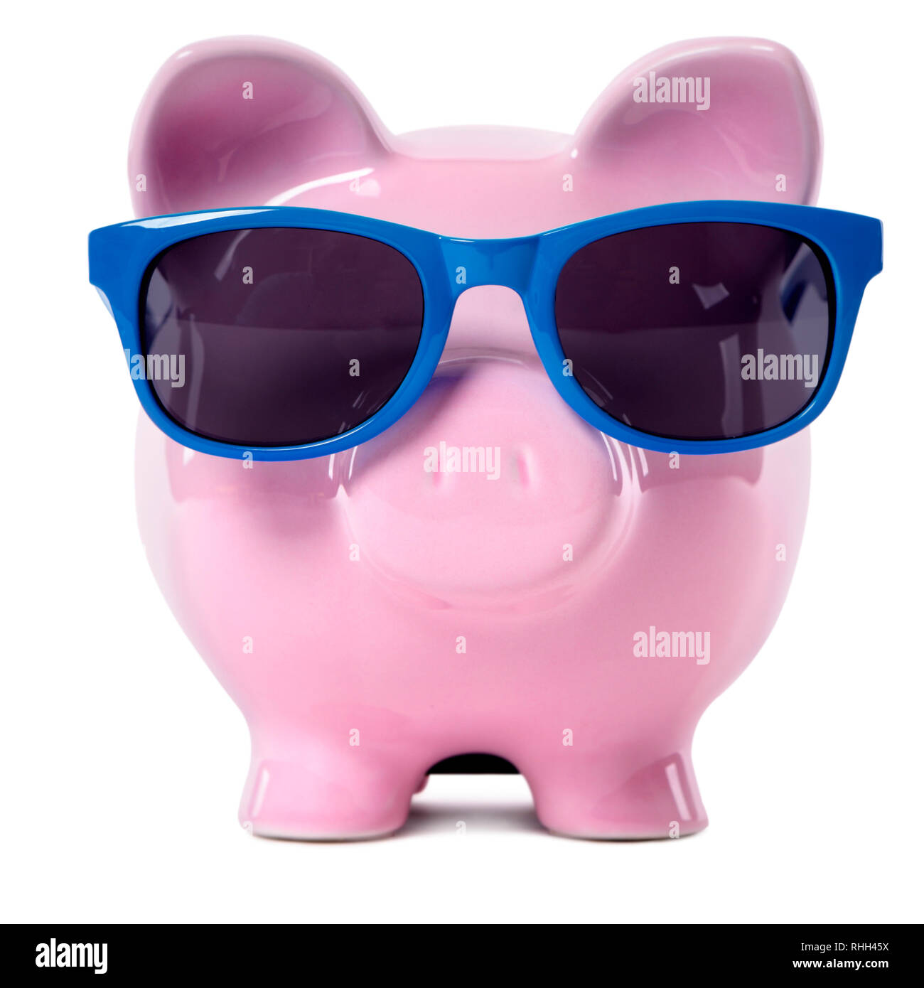 Pink piggy bank blue sunglasses. Stock Photo