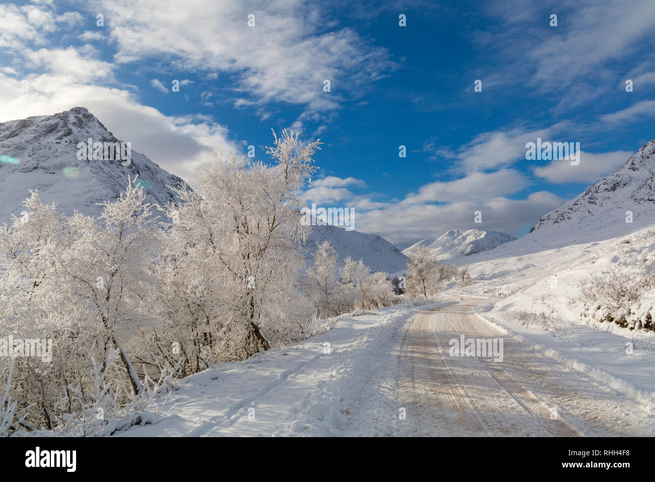 hoar frost turns the scene into a winter wonderland along the long road by Coupall Falls to Glen Etive at Rannoch Moor, Highlands, Scotland in Winter Stock Photo