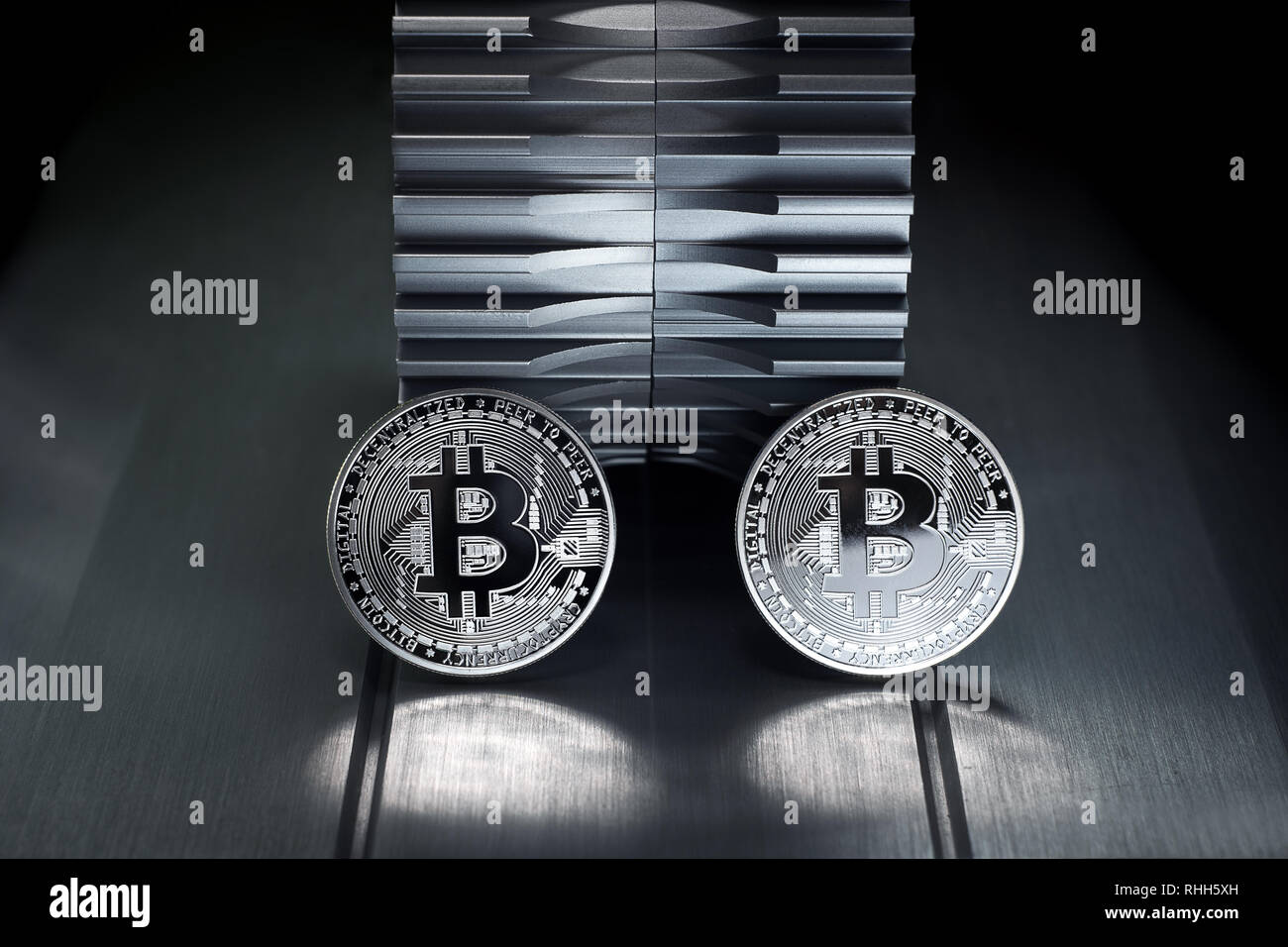 Silver bitcoin stand on the metal with gearwheel in the background. Digital  Crypto currency revolution Stock Photo - Alamy