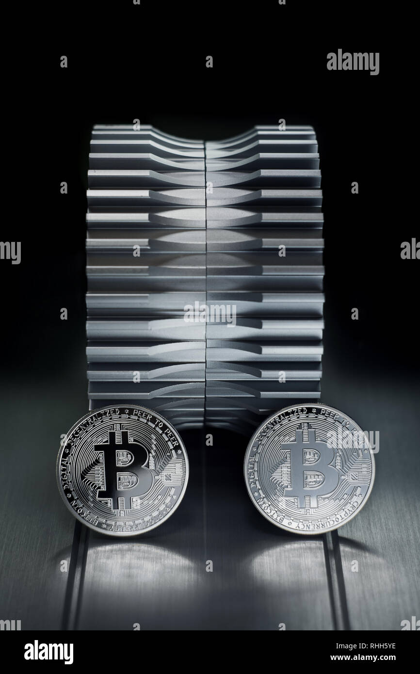 Silver bitcoin stand on the metal with gearwheel in the background. Digital  Crypto currency revolution Stock Photo - Alamy
