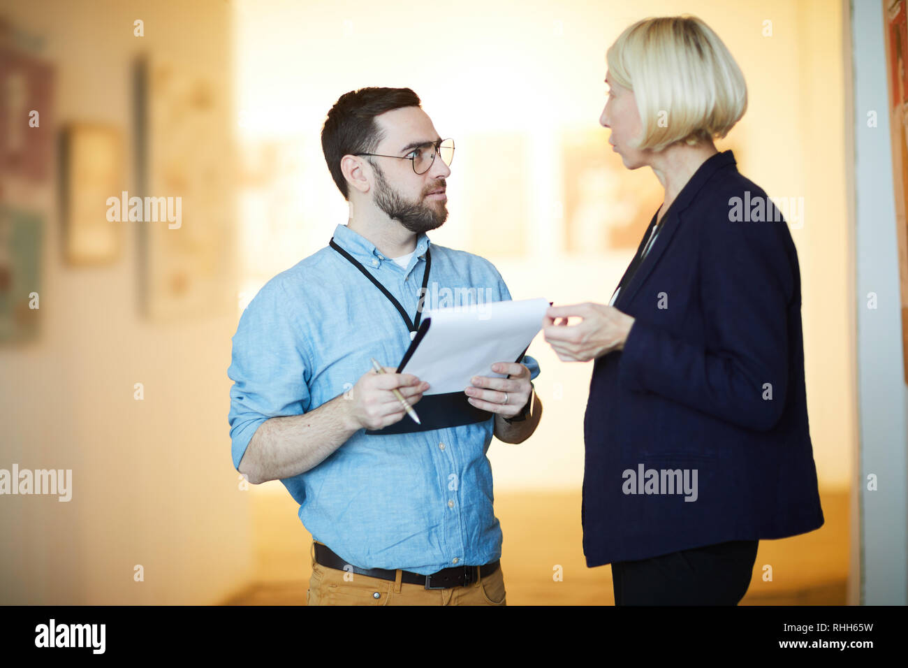 Two Art Gallery Workers Stock Photo Alamy