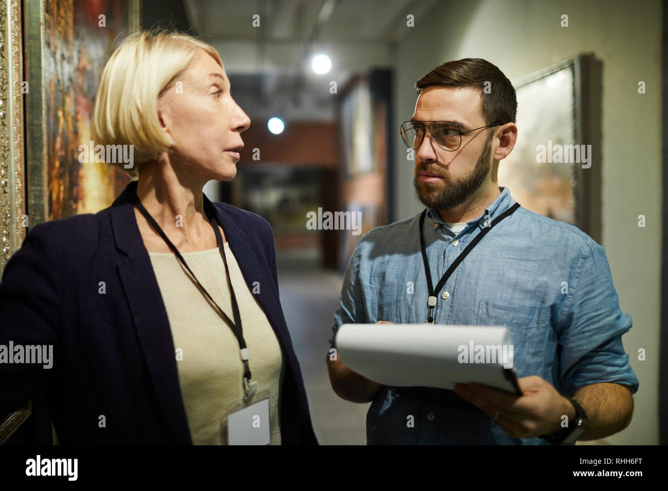 Two Art Gallery Workers Stock Photo Alamy