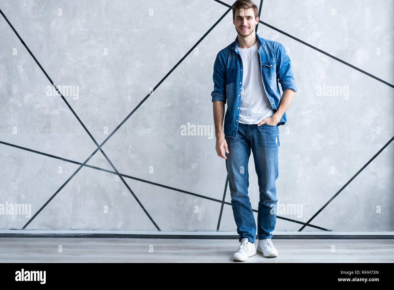 handsome young man in jeans shirt 