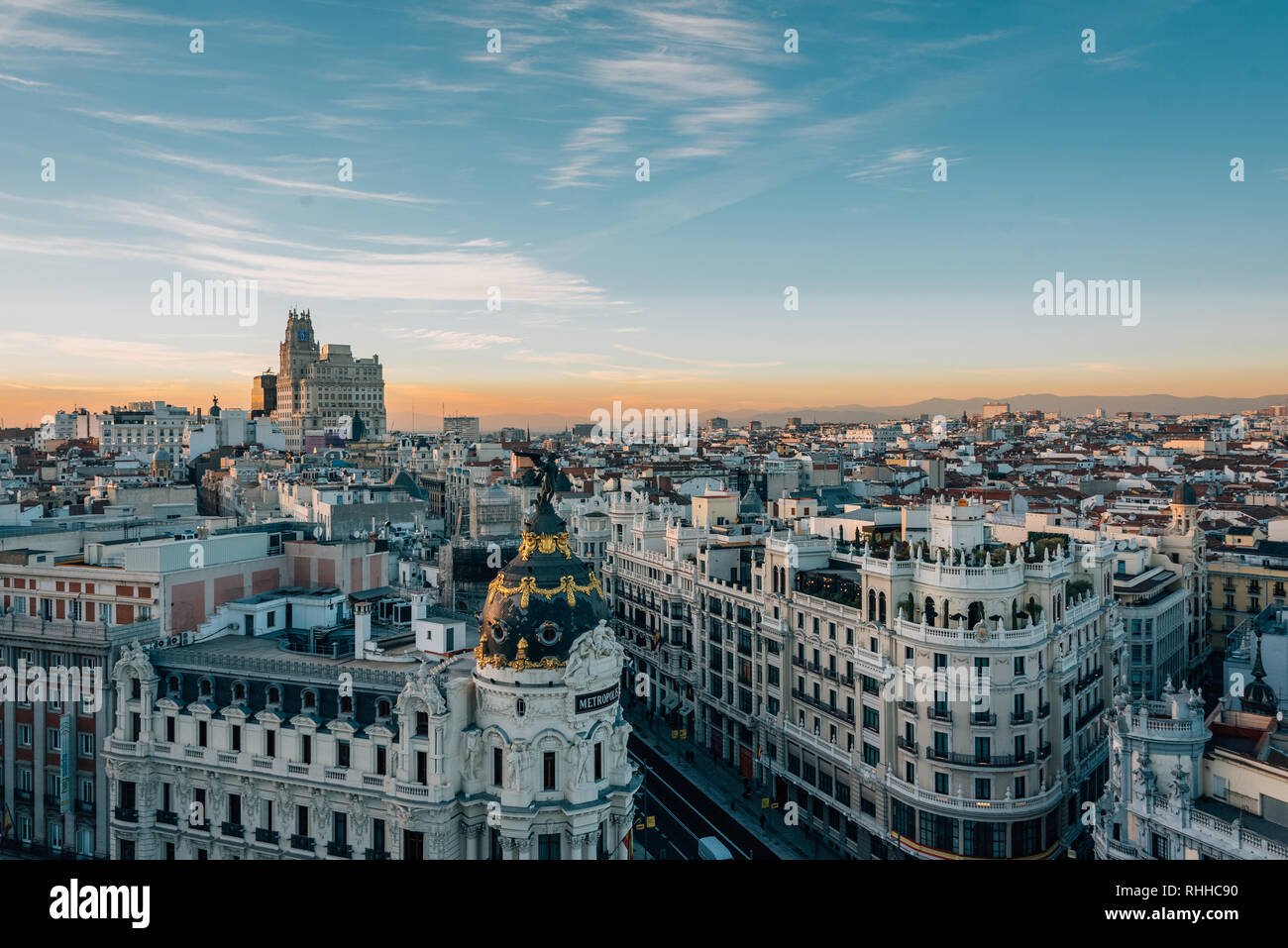 View of the Metropolis Building and Gran Via from the Circulo de Bellas Artes rooftop at sunset, in Madrid, Spain Stock Photo