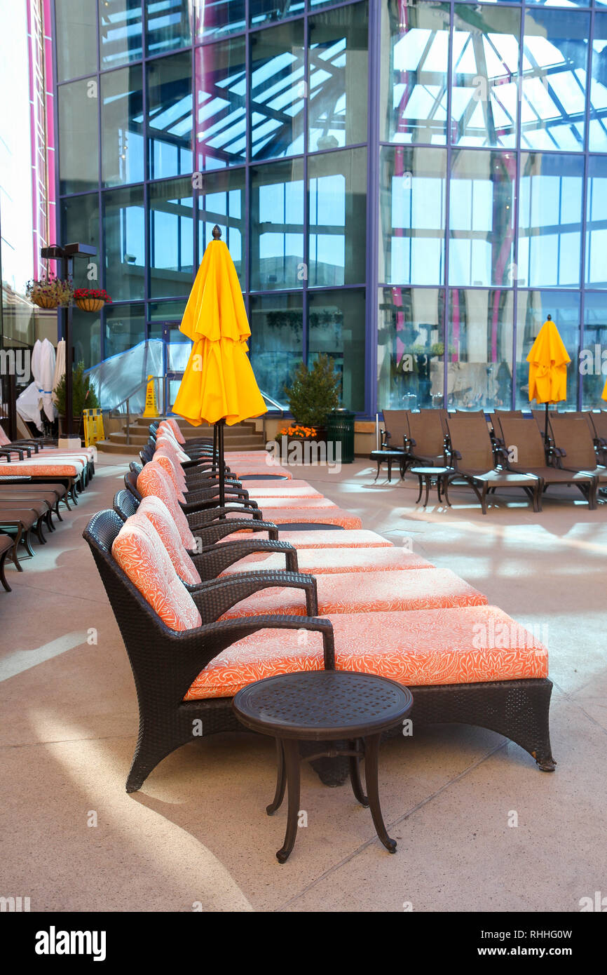 Lounge chairs near the outdoor pool at the Atlantis Casino Resort Spa, Reno, Nevada, United States Stock Photo
