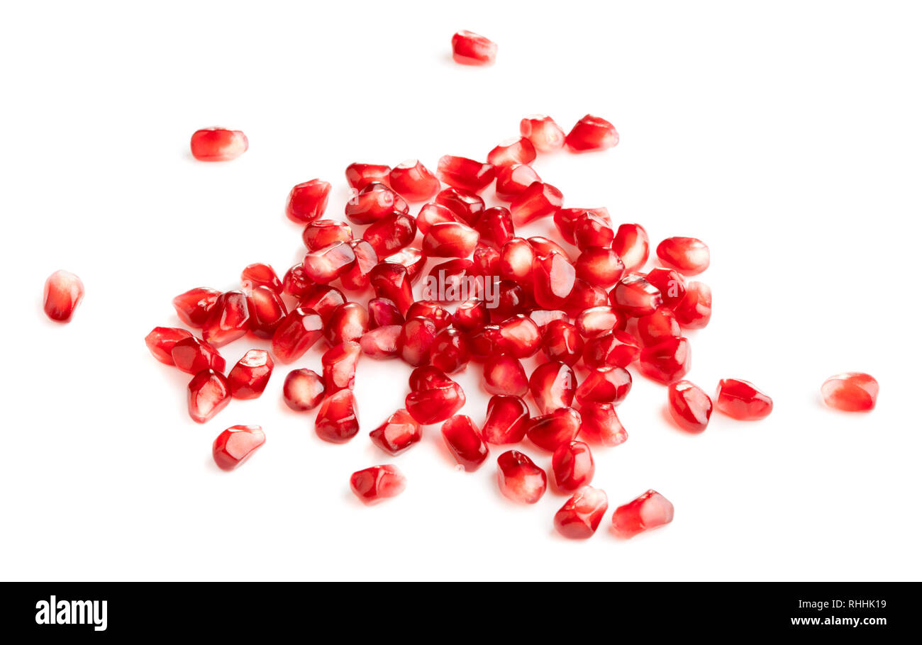 pile of fresh pomegranate seeds isolated on white background Stock Photo