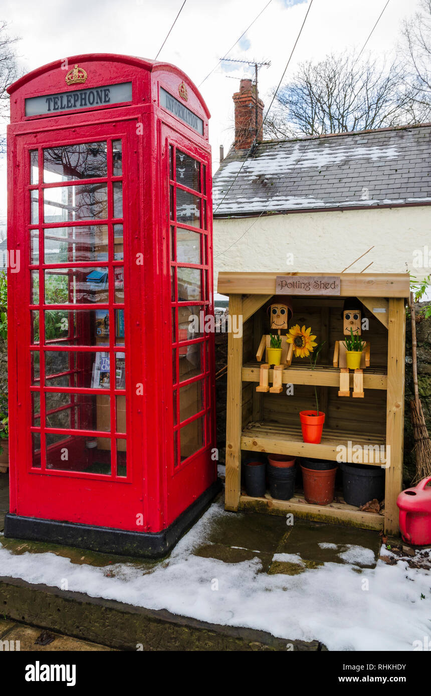 February 2, 2019 Tremeirchion, UK. A traditional British telephone box has been repurposed as a tourist and community information booth. Stock Photo