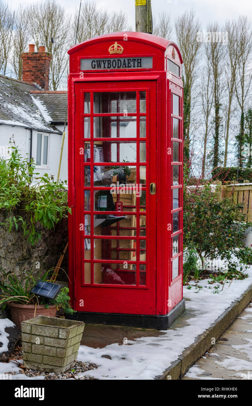 February 2, 2019 Tremeirchion, UK. A traditional British telephone box has been repurposed as a tourist and community information booth. Stock Photo