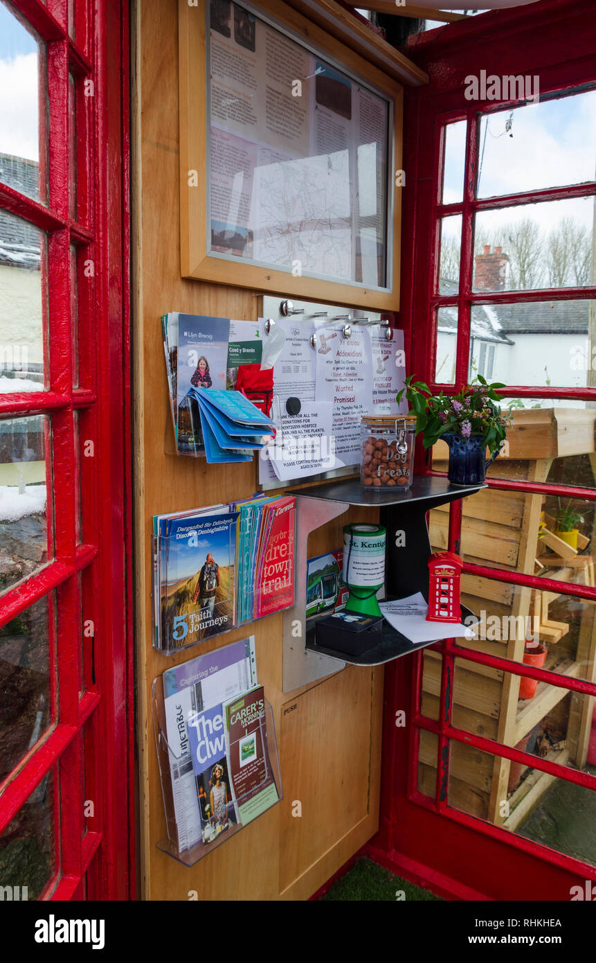 February 2, 2019 Tremeirchion, UK. A traditional British telephone box has been repurposed as a tourist and community information booth. Stock Photo