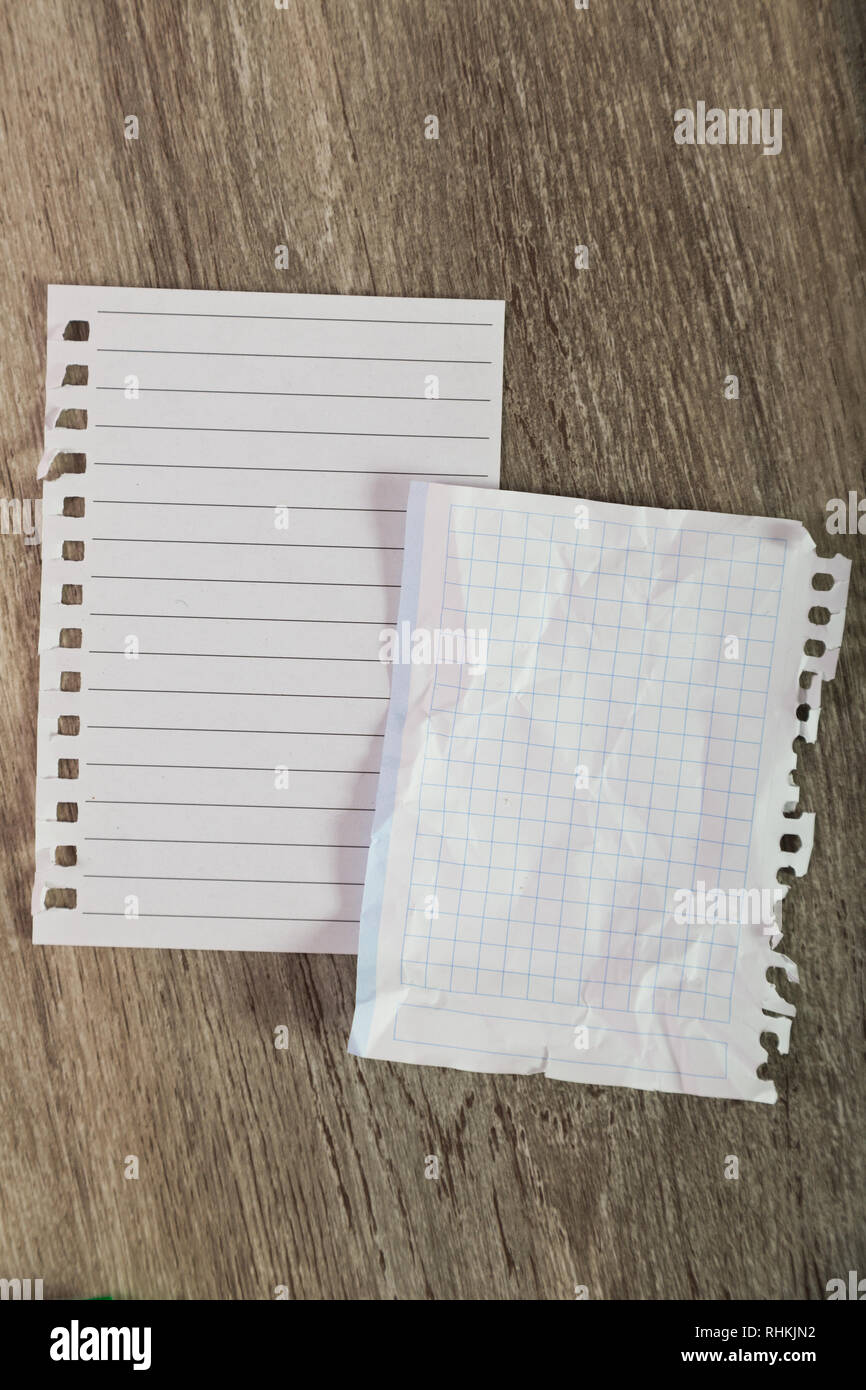 Torn sheets in notebook on table Stock Photo