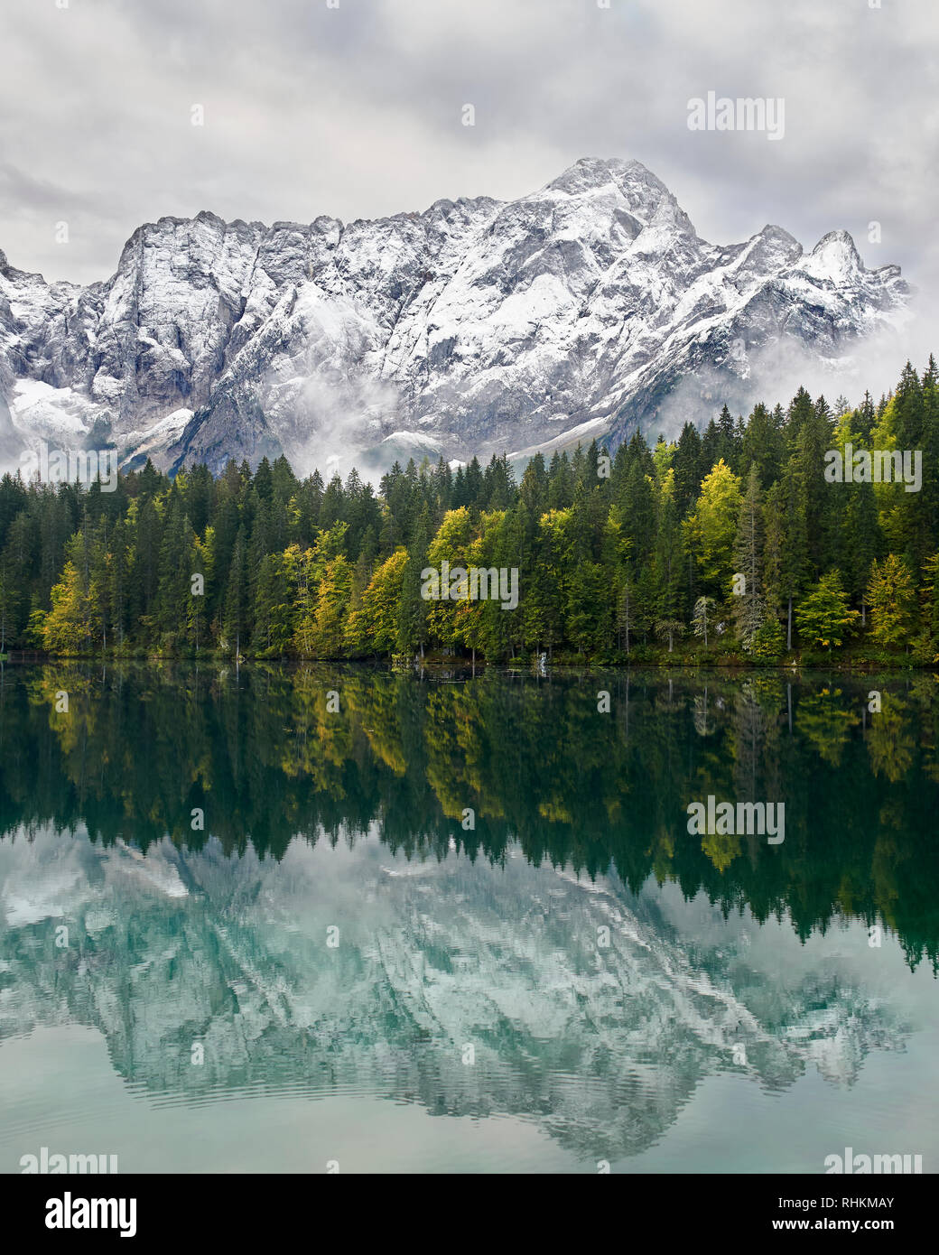 Mangart reflected in Lago Superiore, Laghi di Fusine, Friuli, Italy Stock Photo