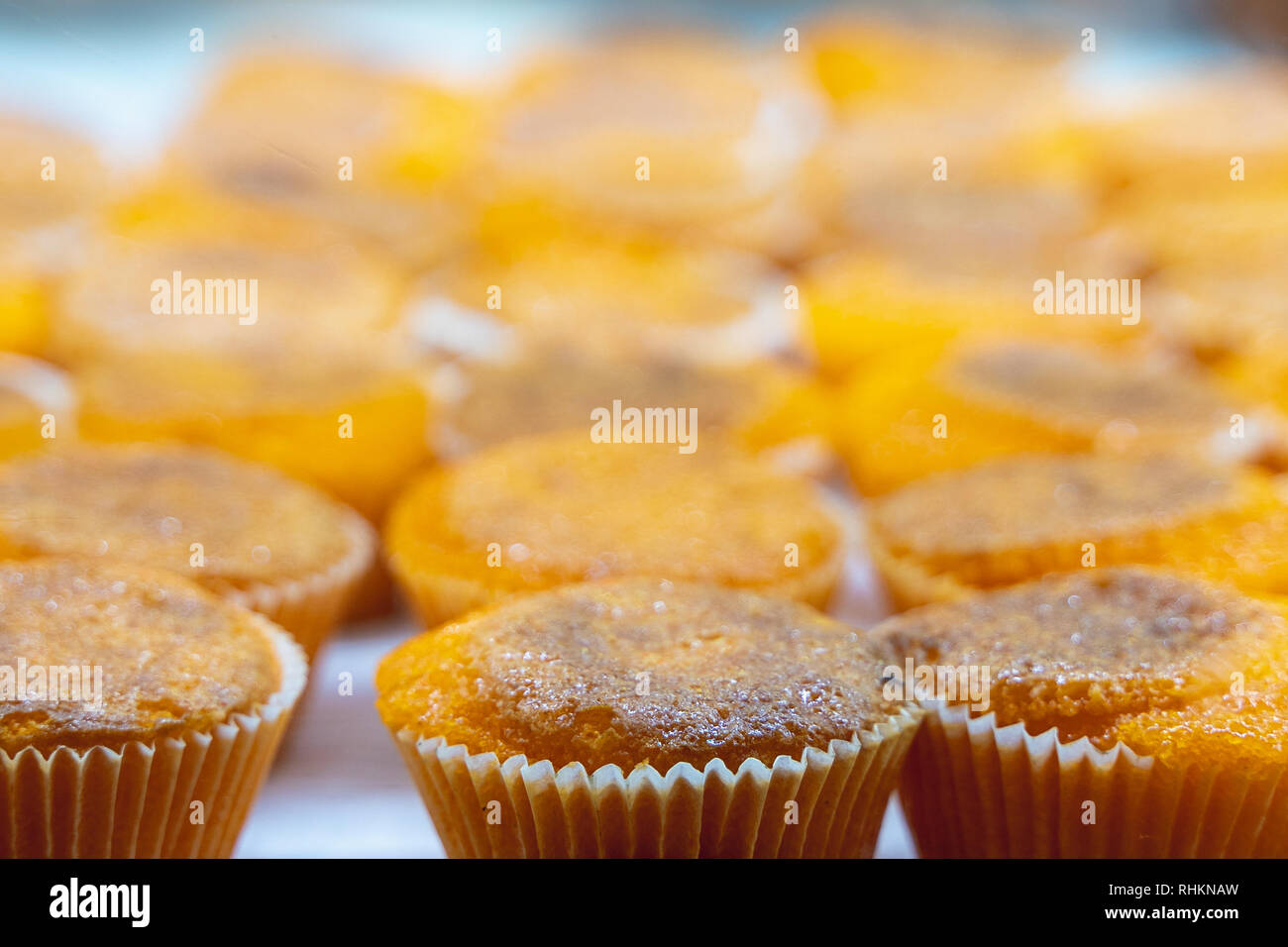 Delicious orange yellow bean cakes / muffins from Lisbon Portugal Stock Photo