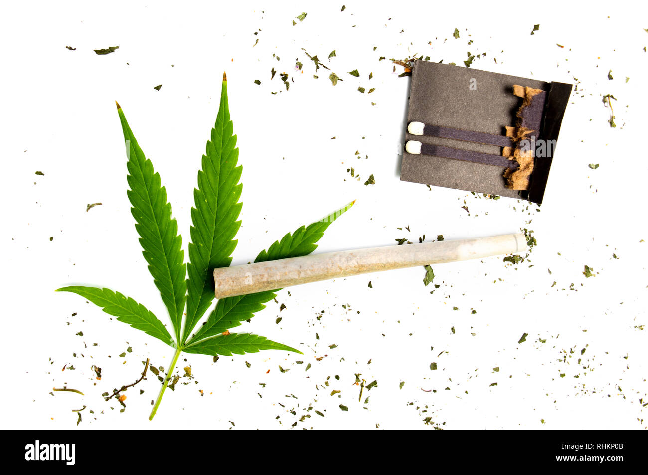 Marijuana leaf and wrapped joint on white background Stock Photo Alamy