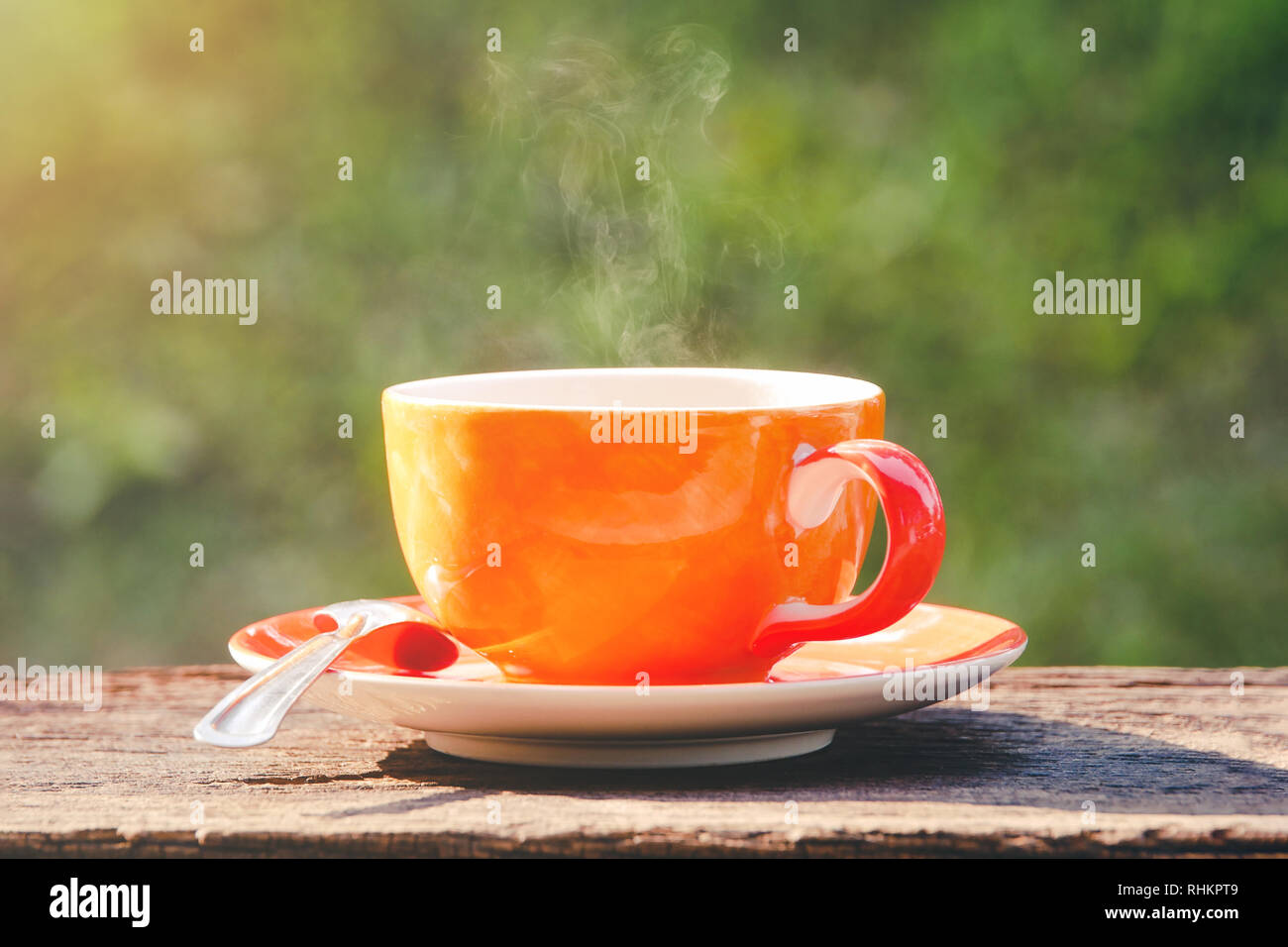 hot coffee cup refresh morning time on natural green background Stock Photo