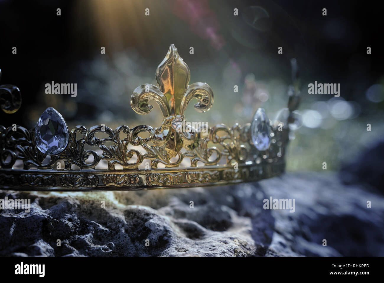 mysterious and magical photo of gold king crown over the stone in the ...