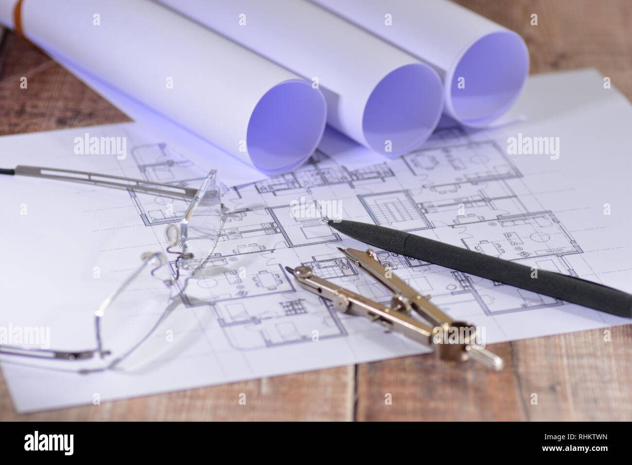 Architects drawings on a wooden table Stock Photo Alamy