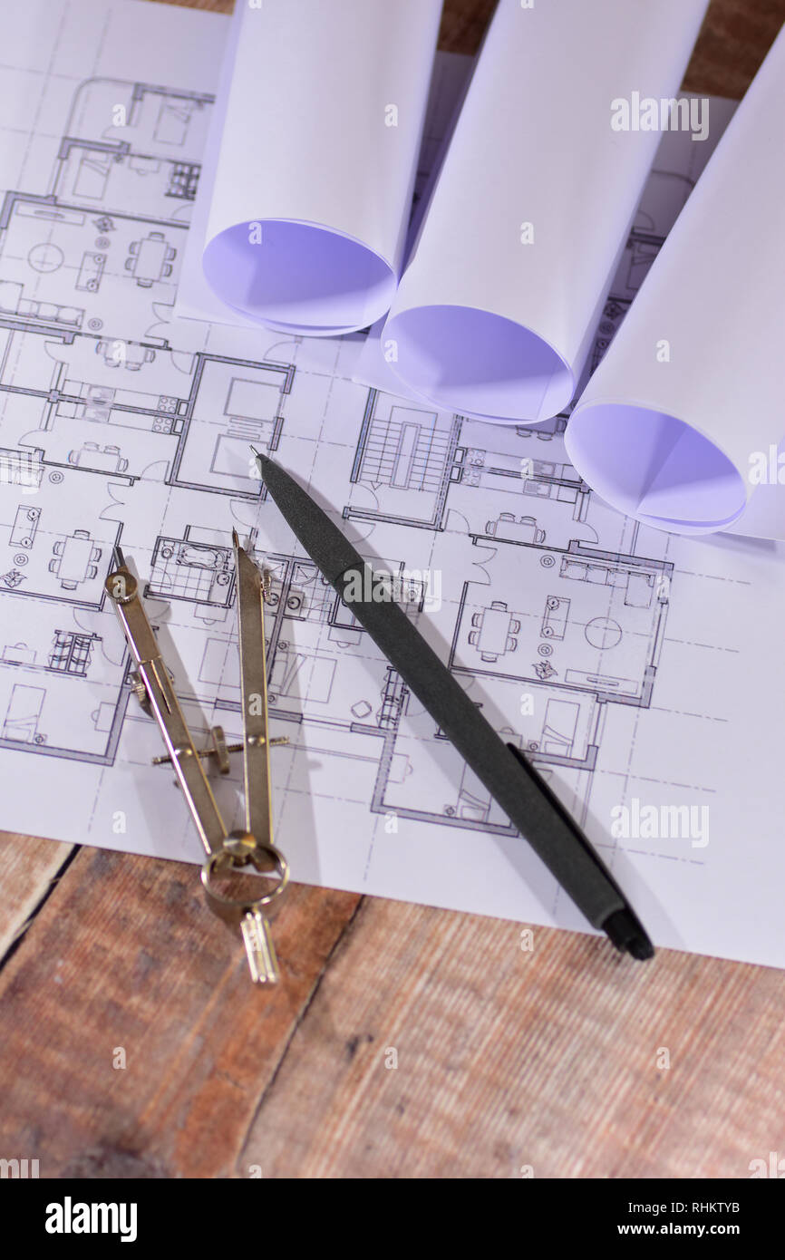 Architects drawings on a wooden table Stock Photo