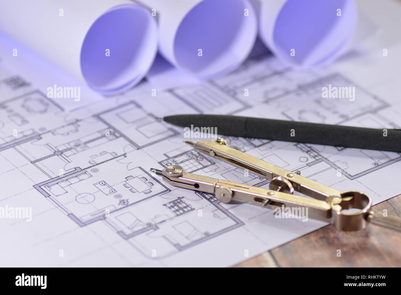 Architects drawings on a wooden table Stock Photo