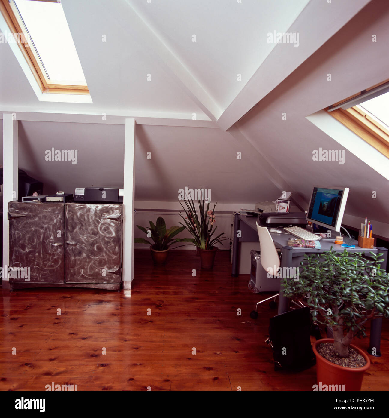 Wooden flooring in loft conversion study Stock Photo Alamy