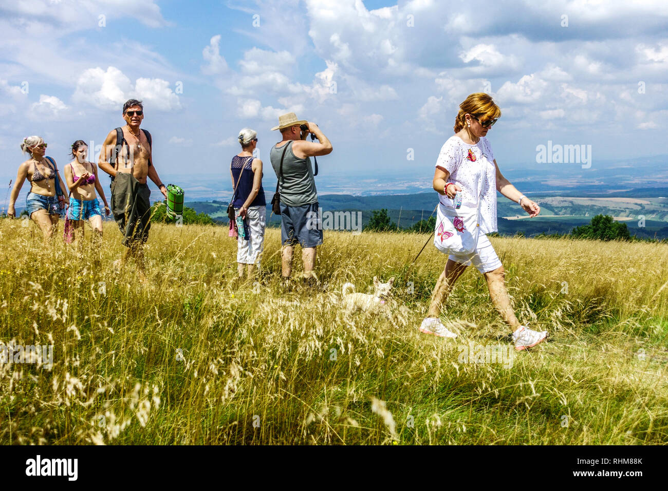 People on a trip, mountain meadow in the White Carpathians Mountains, Velka Javorina, Czech Slovak border Stock Photo