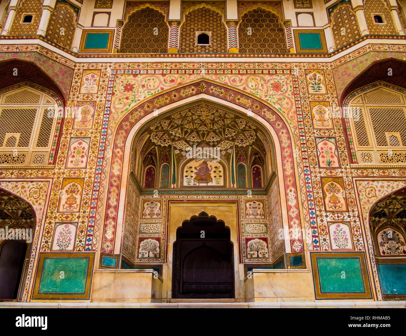 Impressive facade of Ganesh Pol entrance in Amber Fort Palace, Jaipur, Rajasthan, India Stock Photo