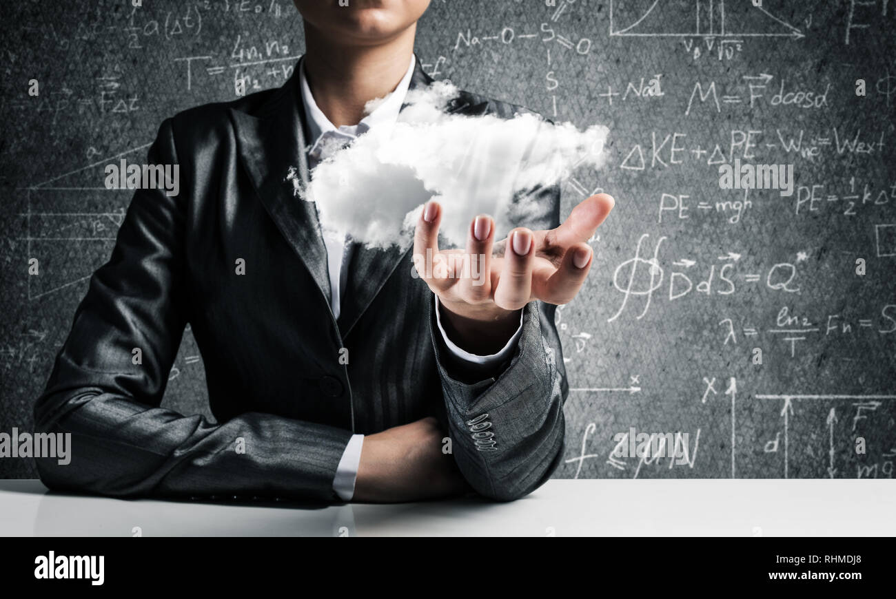 Woman presenting cloud in her hand Stock Photo - Alamy