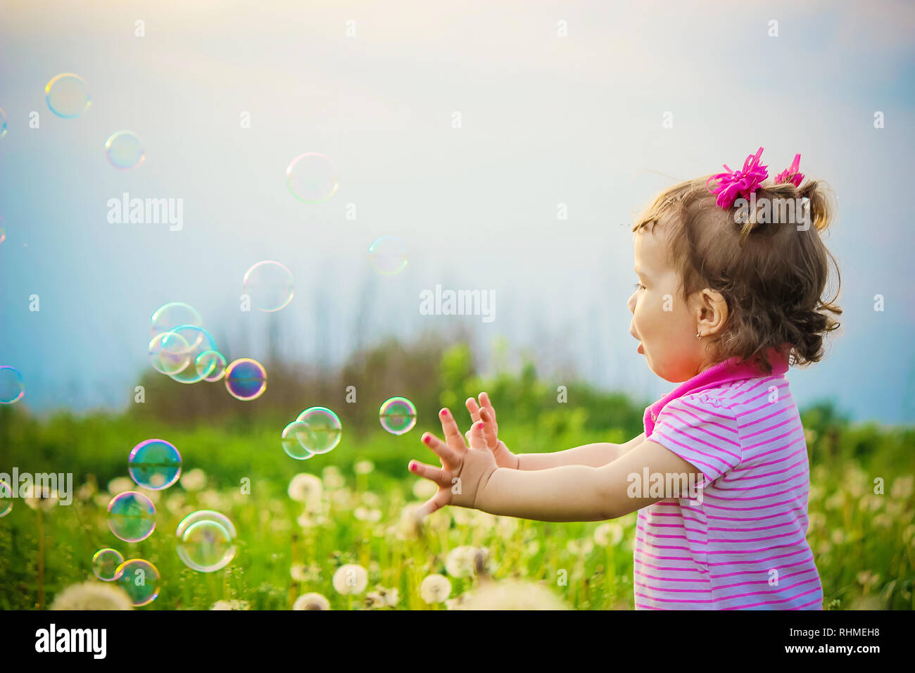 Mom blows bubbles baby hires stock photography and images Alamy