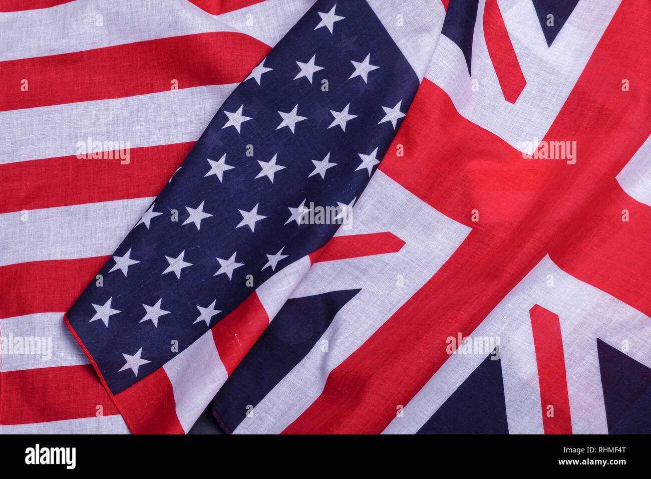 Two flags English union jack and USA star spangled banner. Material symbols of first world countries Stock Photo