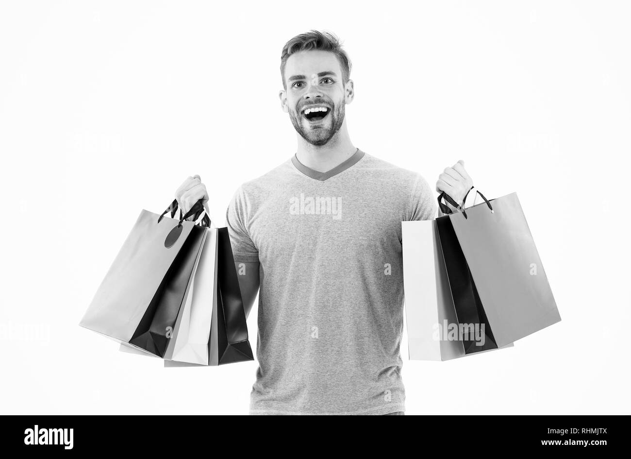 Positive man enjoying shopping. happy man with shopping bags isolated on white. Excited happy man doing online shopping. Thanks for your purchase. Quality service. Shopping happiness. Stock Photo