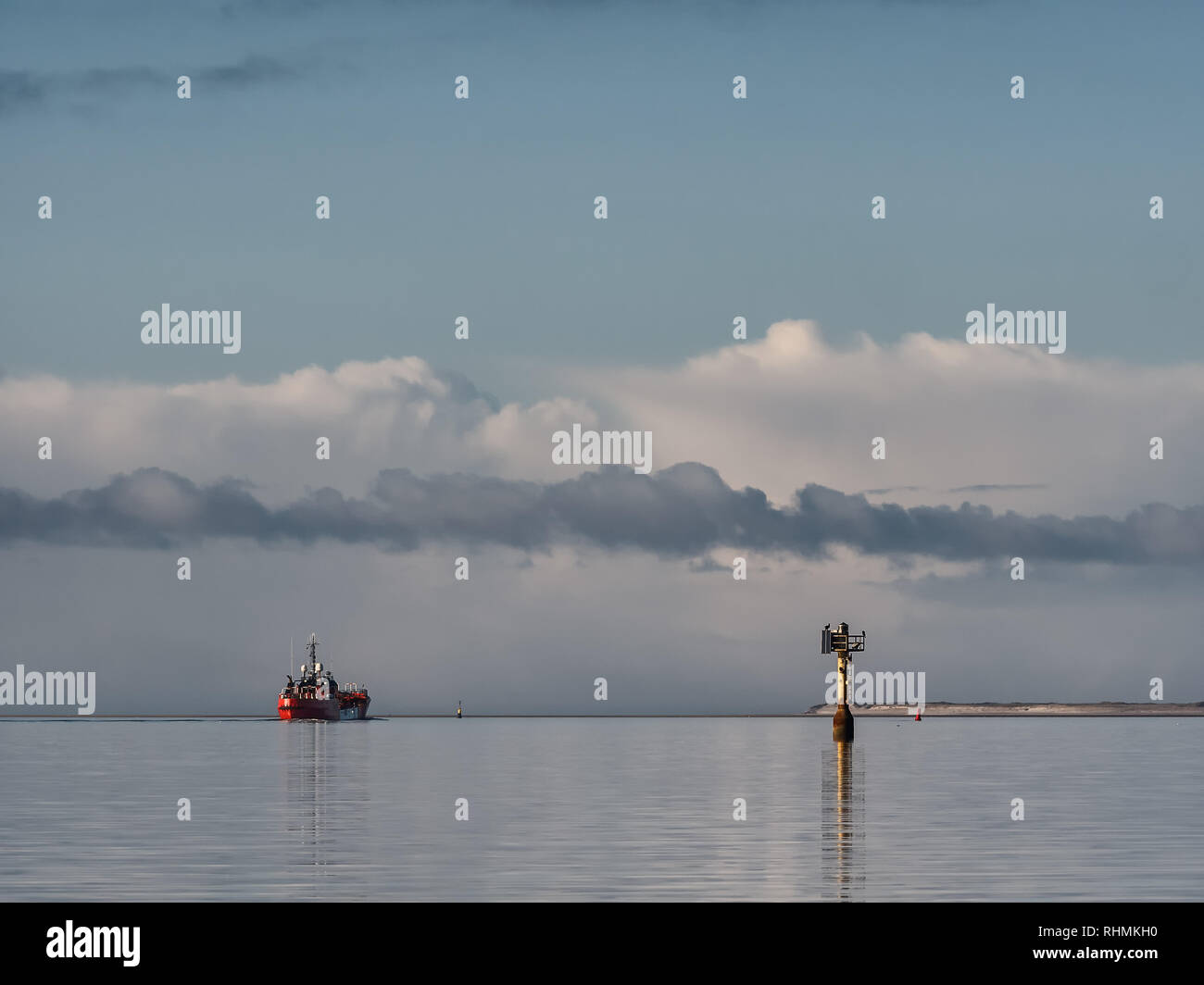 Supply ship leavng Esbjerg offshore harbor, Denmark Stock Photo